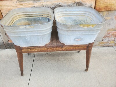 Two aluminum wash tubs