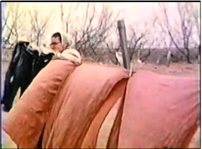 Grandma hanging laundry