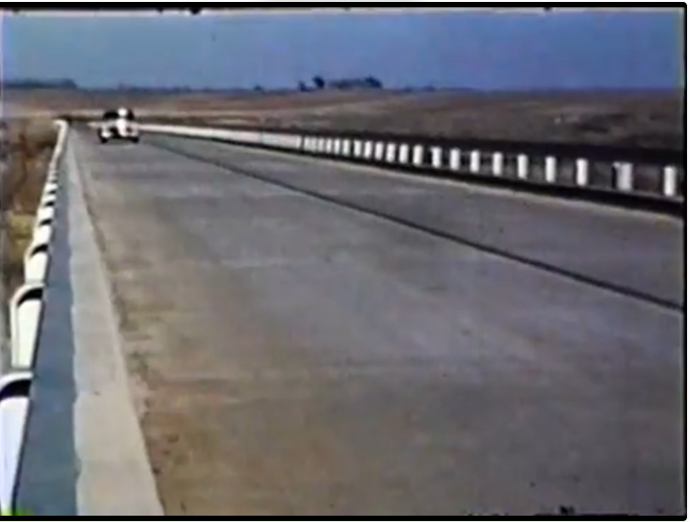 Auto on Highway 256 bridge over the Prairie Dog Town branch of the Red River